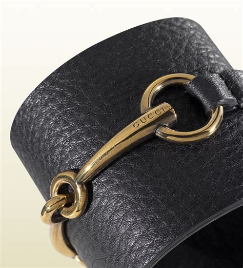 gucci black leather bracelet.